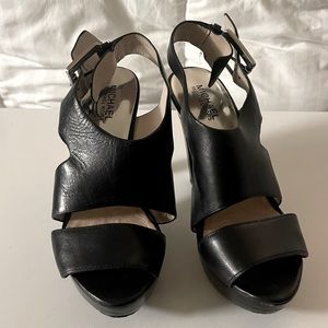 Black Michael Kors heels; leather straps.